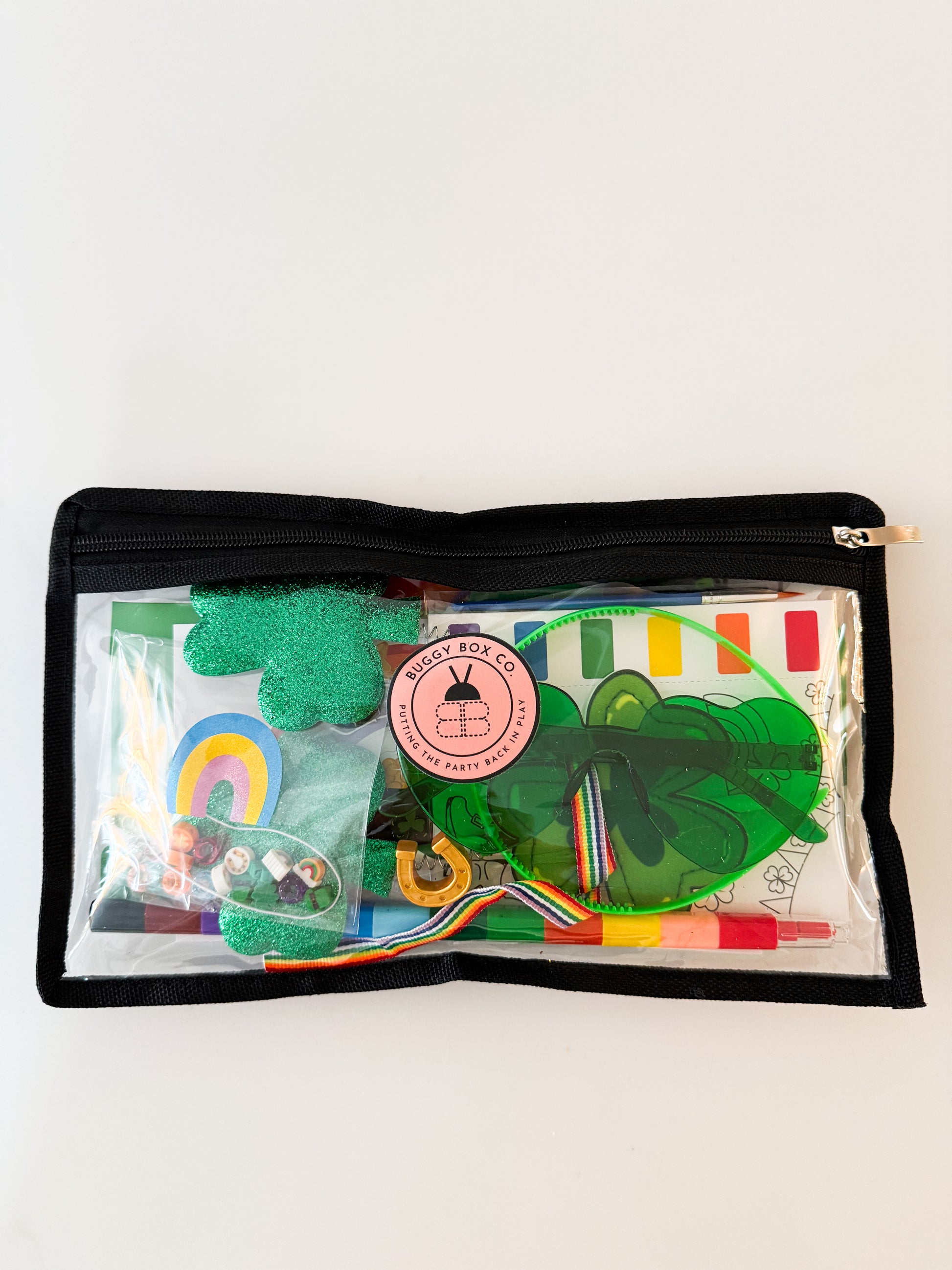 Zipped Lucky Bug Buggy Bag filled with St. Patrick’s Day crafts and screen-free activity supplies for kids
